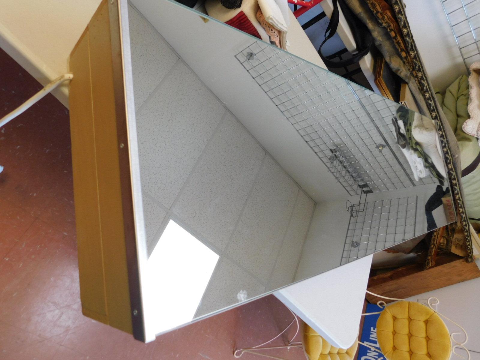 Mirrored Cabinet Holds Ironing Board