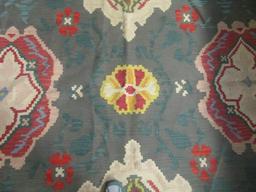 Woven Rug with Geometric Floral Design