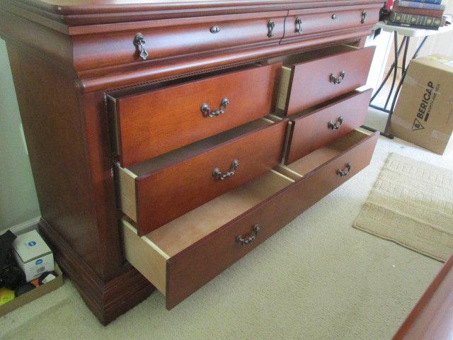 Eight Drawer Dresser with Framed Beveled Mirror