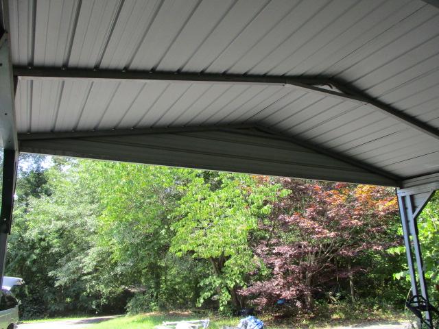 Green Metal Carport Approx. 20' x 30'