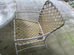 Round Table with Pebble Glass Top and Four Chairs with Plastic Woven Seat/Back