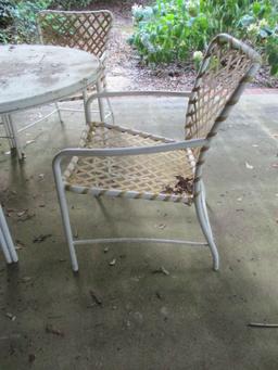 Round Table with Pebble Glass Top and Four Chairs with Plastic Woven Seat/Back