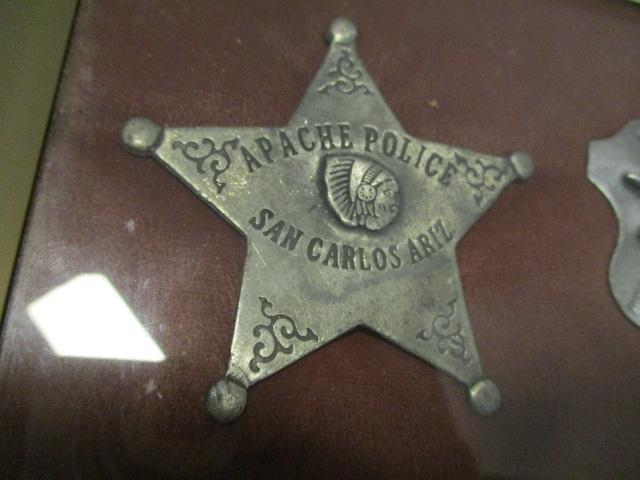 Four Western Era Badges in Display Case