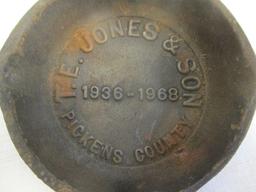 Two TE Jones Cast Iron Ashtrays:  1 Dated 1968. One "00" Ashtray
