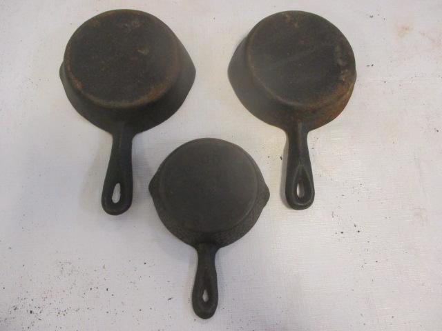 Two TE Jones Cast Iron Ashtrays:  1 Dated 1968. One "00" Ashtray