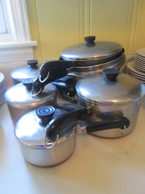 Seven Revere Ware Pots and Pans with Lids