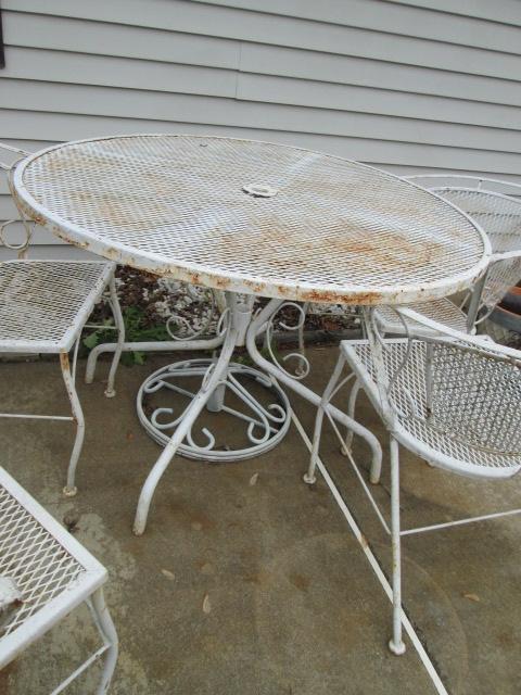 White Wrought Iron Table with Four Chairs