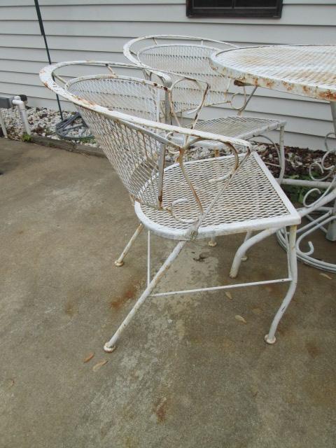 White Wrought Iron Table with Four Chairs