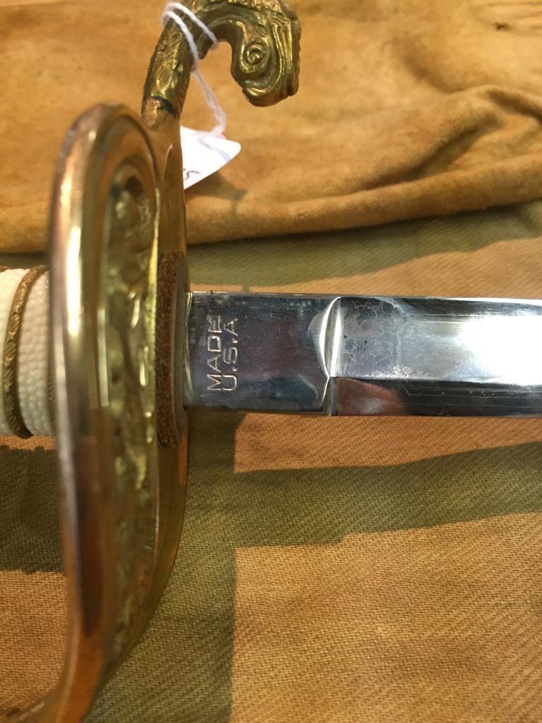 Antique etched U.S.N Naval officers sword with ornate brass and bead handle, sheath, and cover - see