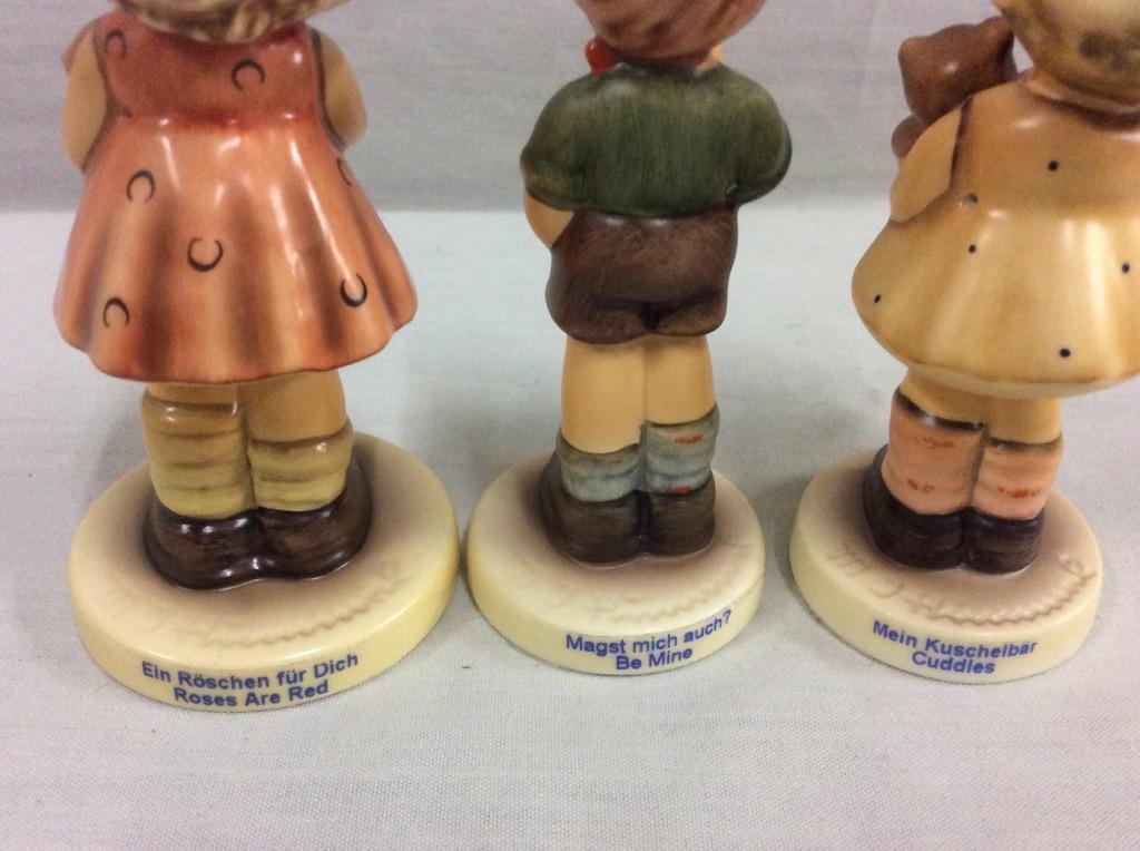 Collection of 7 TMK8 Hummel figurines + Goebel "Fisherman's Feast" display