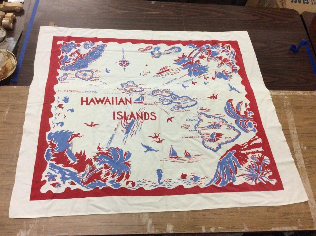 Collection of 12 vintage 1960's Hawaii themed items, includes 3 tablecloths, napkins, side bag