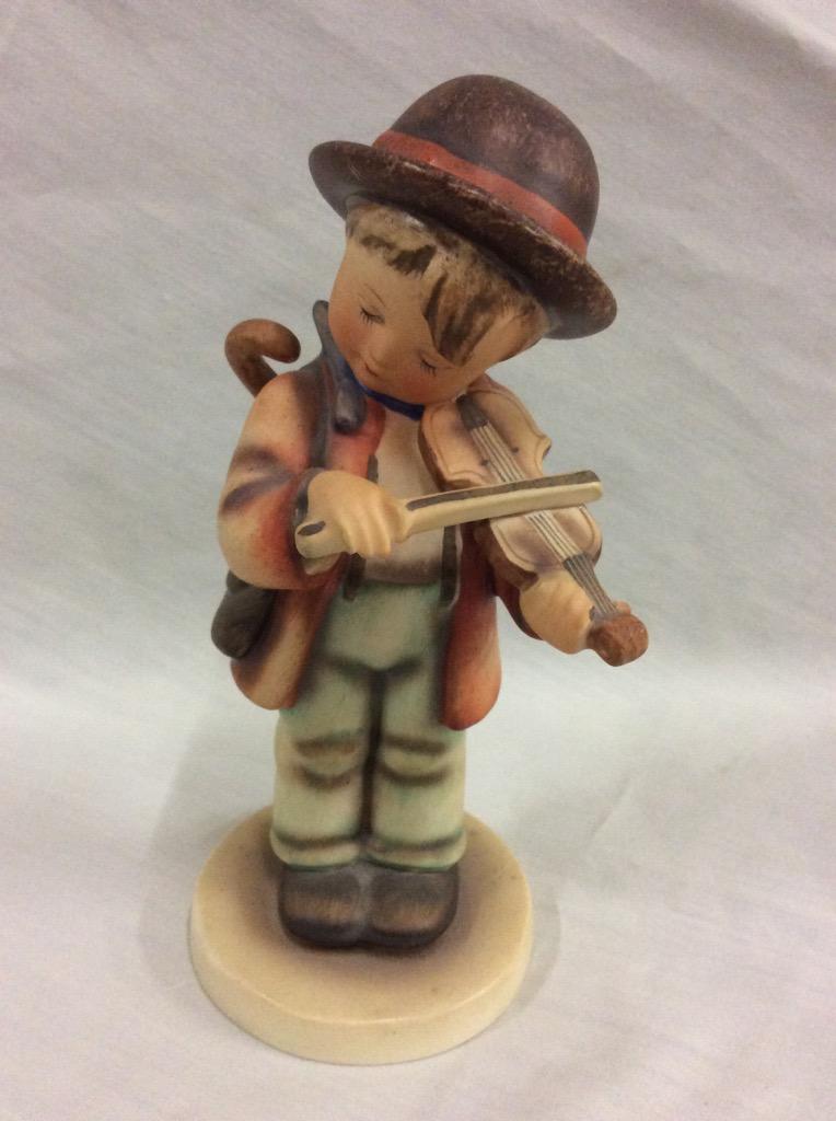 Collection of 4 TMK2 Hummel figurines includes violin boy + trumpet boy