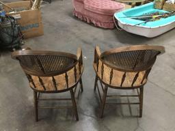 Set of two unique vintage oak spindle back and cane back bent arm dining chairs