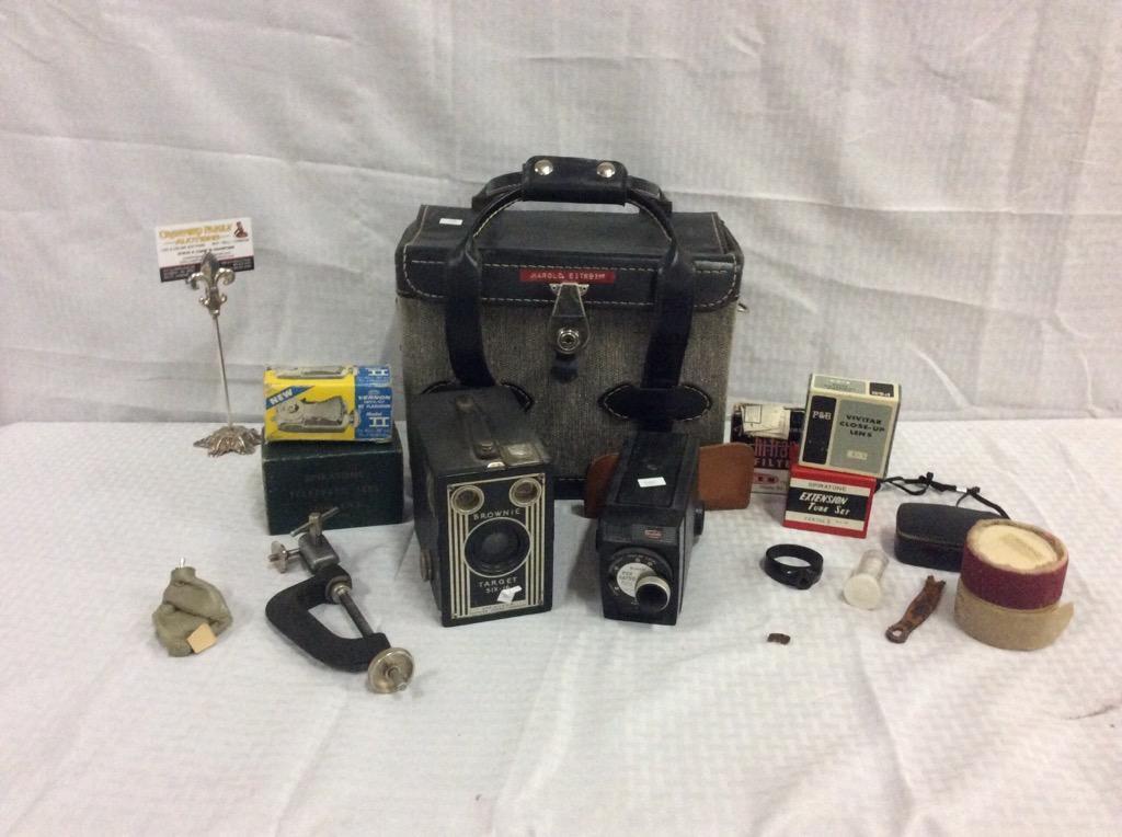 Collection of vintage camera equipment including a brownie target six-16 camera + in a vintage bag
