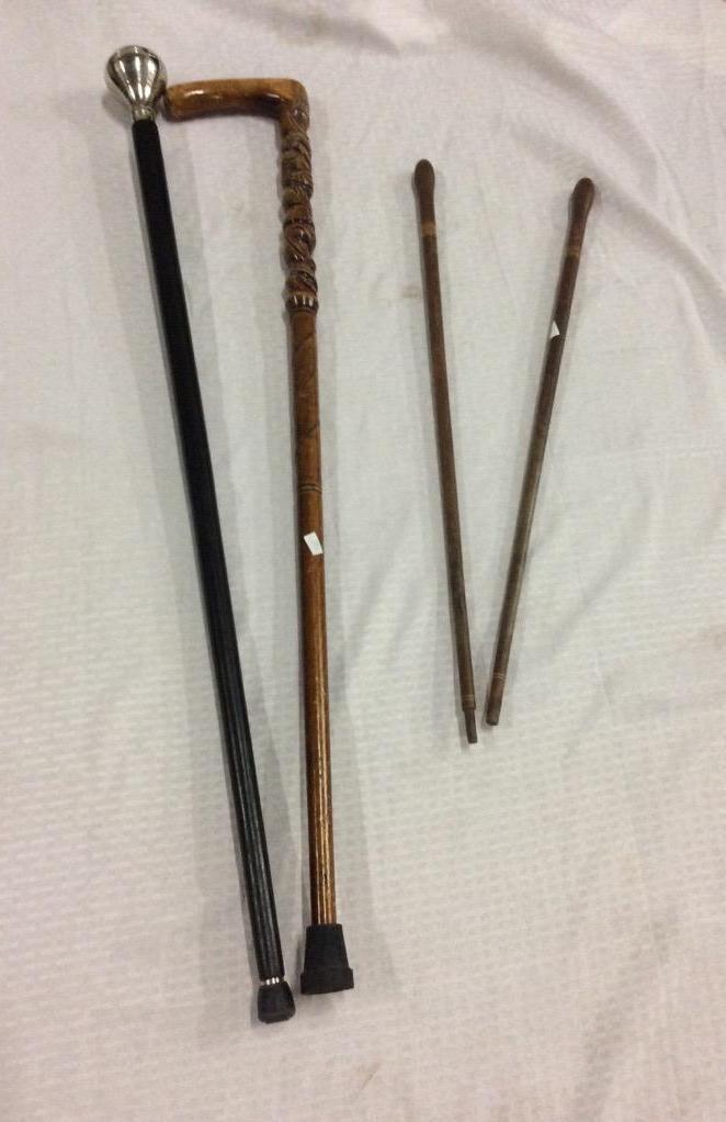 Selection of 2 canes and 2 smaller walking sticks - 3 wood and hand carved + 1 with steel top