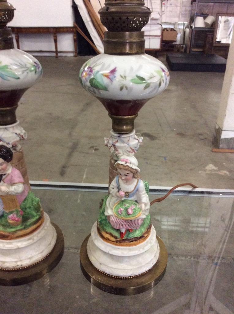 Set of two english porcelain hand painted 50's table lamps with boy/girl bases- no shades as is