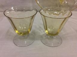 Selection of 26 yellow depression glass items incl glasses, candleholders and a compote