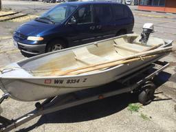 Sears steel boat model no. 61823 with Evinrude Lightwin outboard motor and trailer