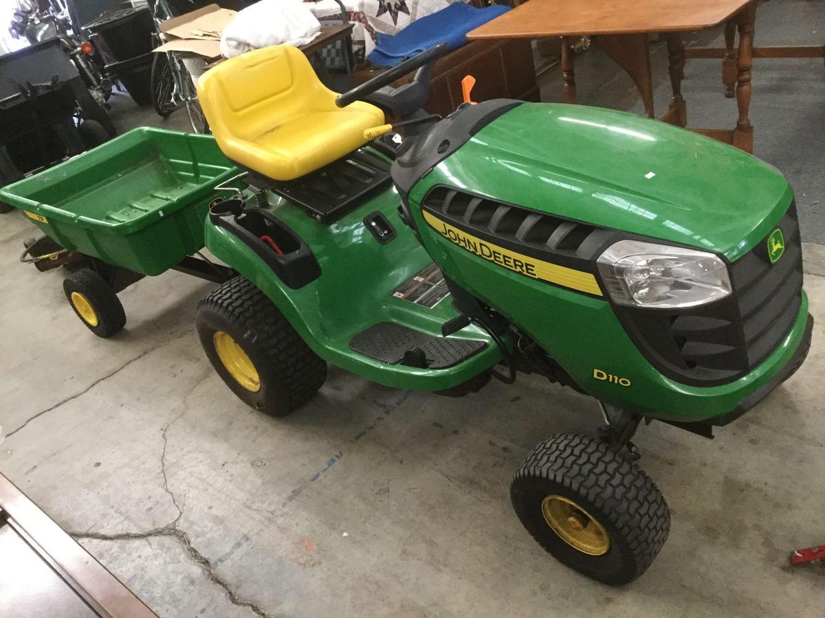 John Deere D110 Riding lawnmower w/ wagon, mower catch & plow attachments - as is see desc