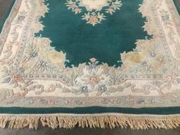 Wool plush rug with fringe and Emerald/Ivory flower design and border as is