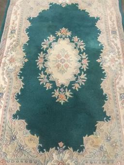 Wool plush rug with fringe and Emerald/Ivory flower design and border as is