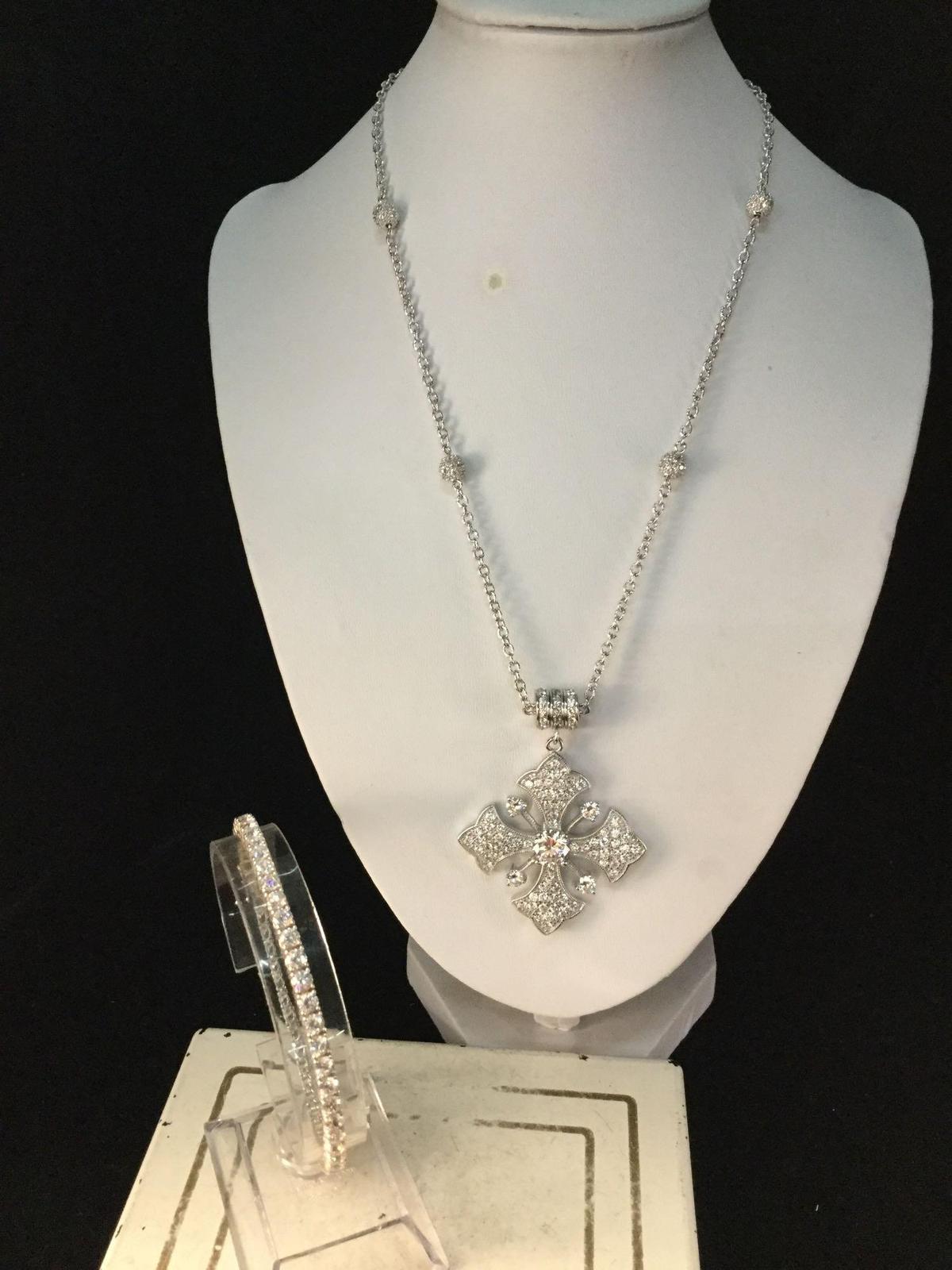 Amazing sterling silver necklace w/ cross pendant and silver bracelet filled w/ CZ?s
