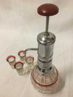 Vintage glass/chrome pump drink dispenser with 4 matching shot glasses and leather padded push pump