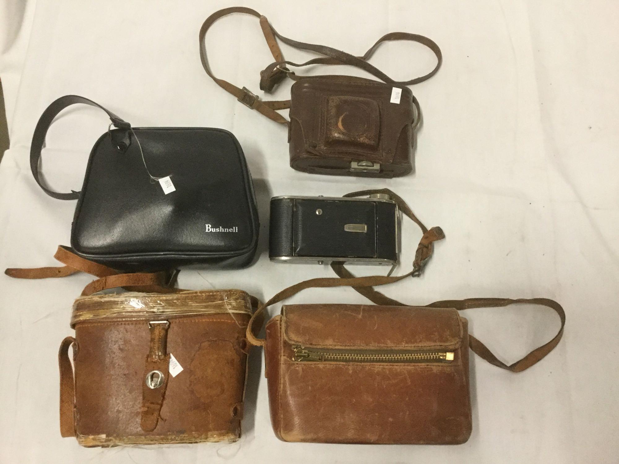 3 vintage cameras and 2 pairs of binoculars incl. Bushnell, Omega, Revere Eight model 80 camera etc