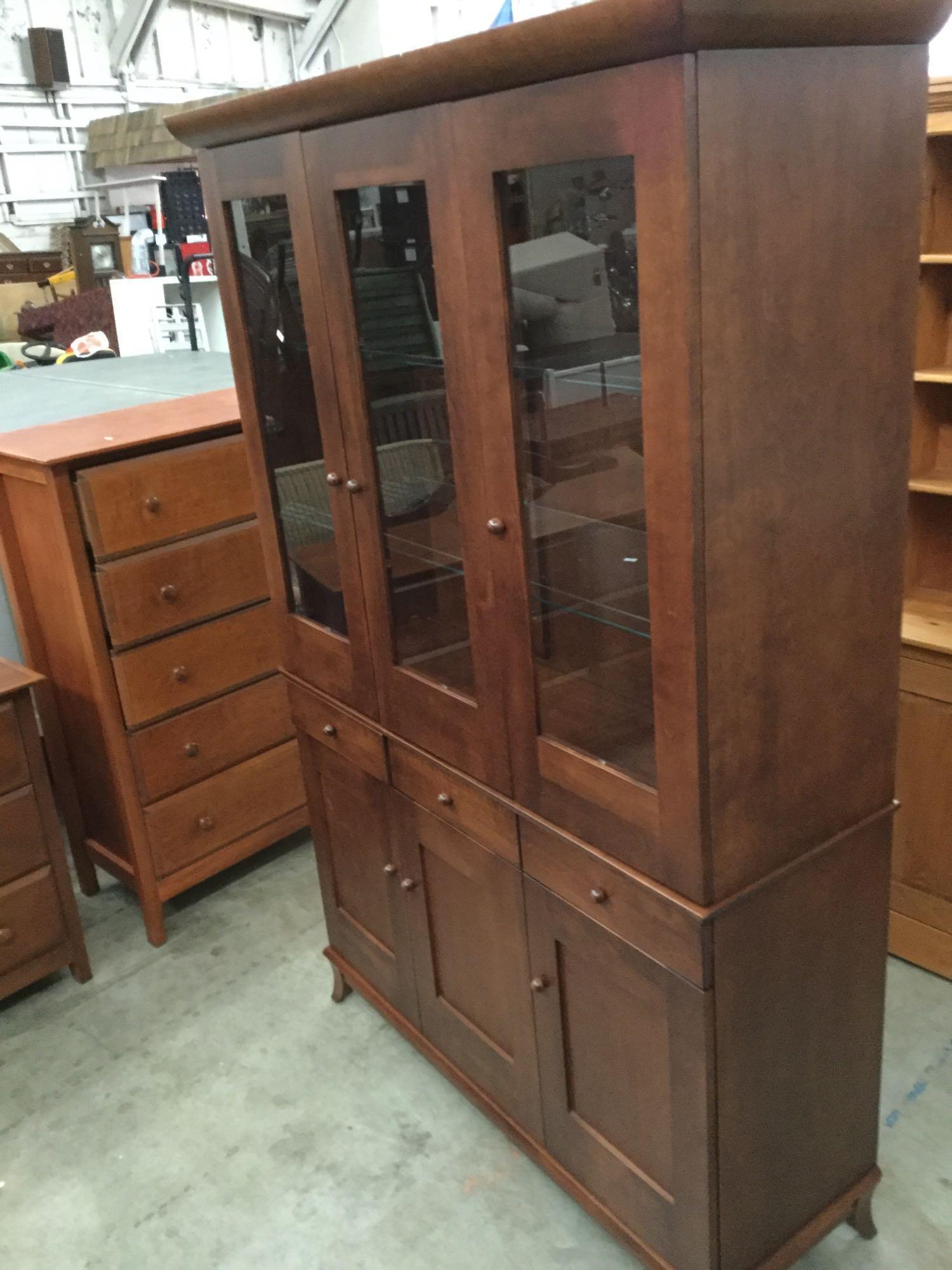 Modern burnished walnut stain china hutch with glass front doors and glass shelves