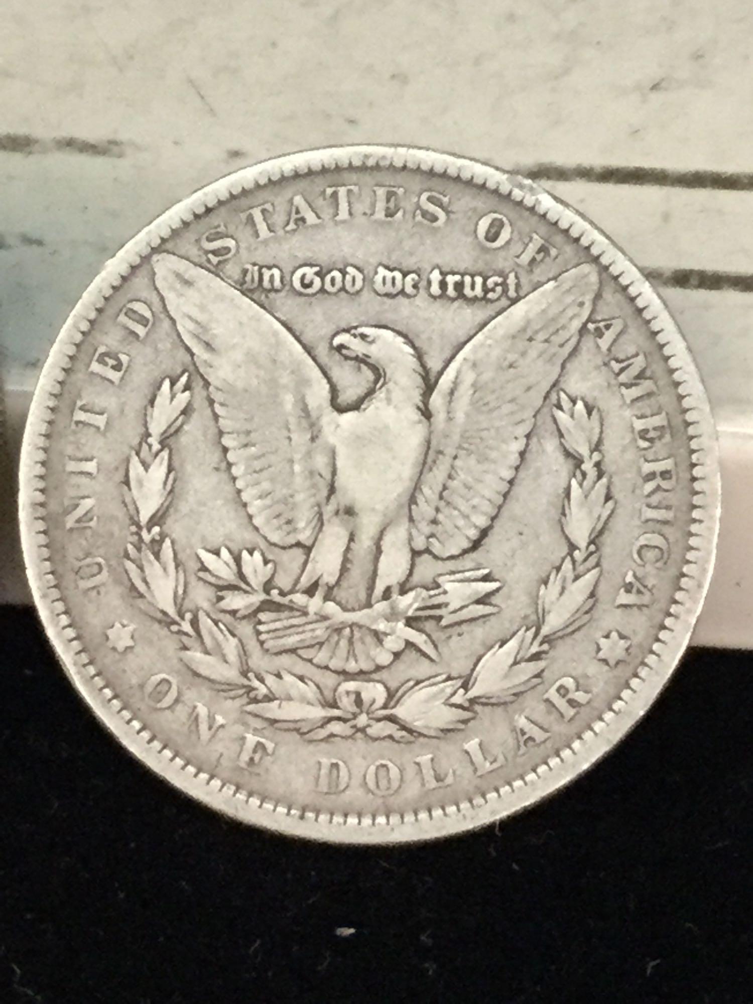 1890-P and a 1891-P silver Morgan dollars