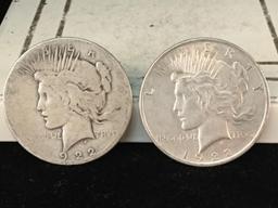 1922 and a 1922-S silver Peace dollars