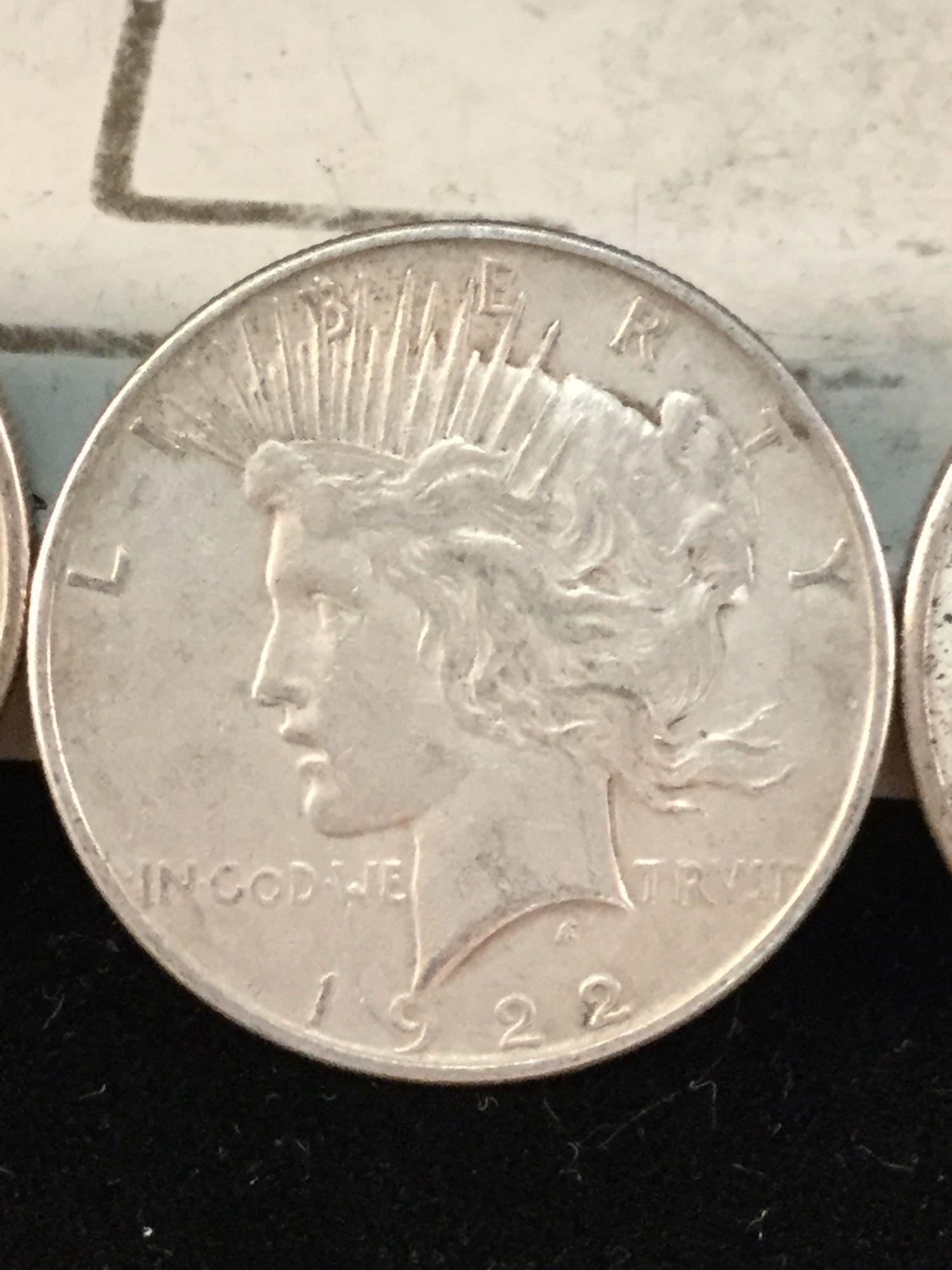 2 1922, a 1923, and a 1926 silver Peace dollars, 4 coins total
