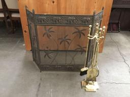 Bronzed African elephant and palm tree motif fireplace screen with brass fireplace set