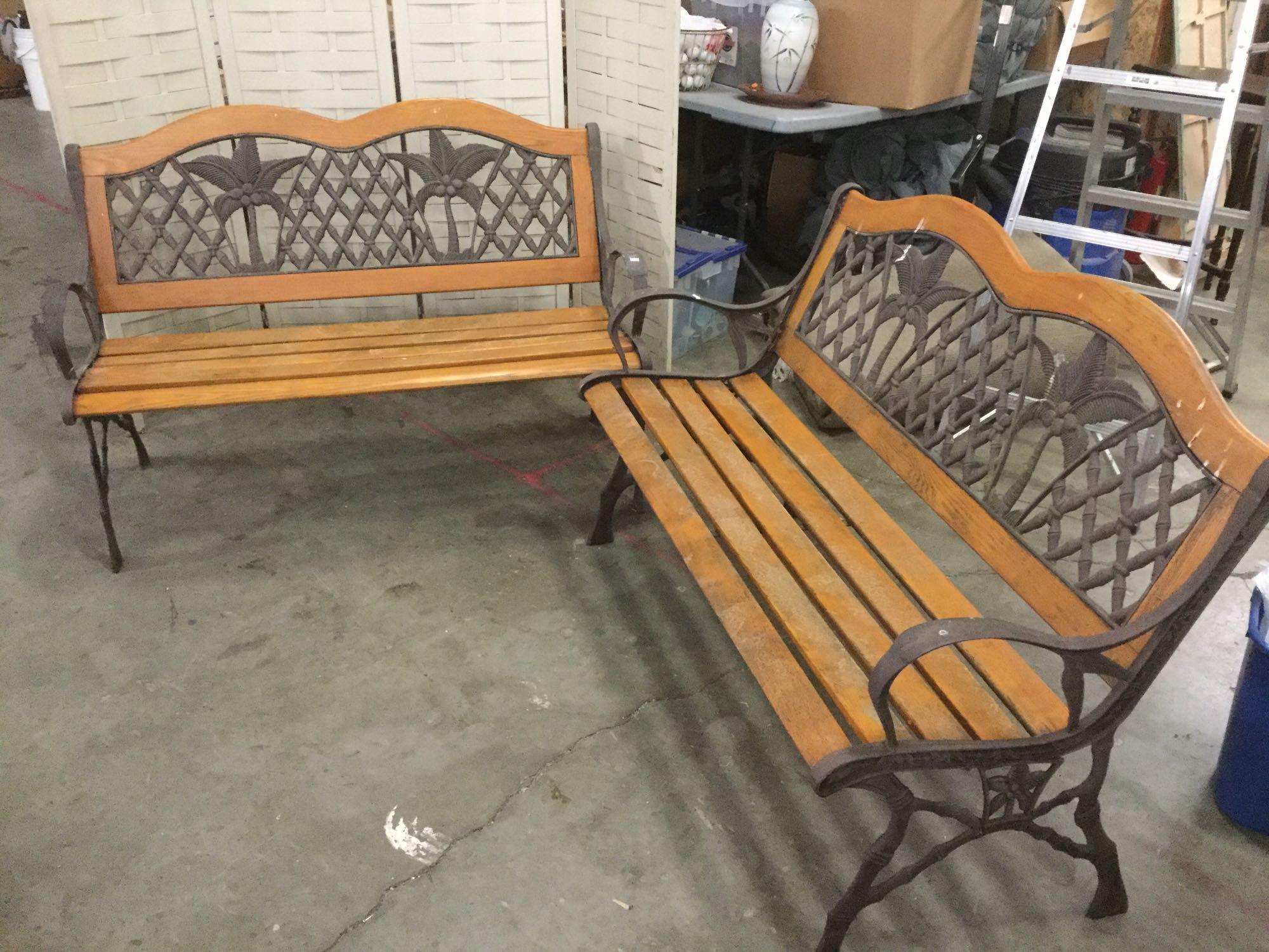 Pair of matching iron and wood benches with coconut tree motif