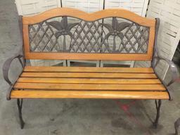 Pair of matching iron and wood benches with coconut tree motif