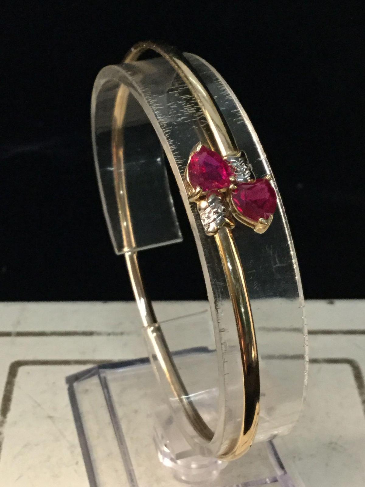 14K yellow gold bracelet w/ heart shaped rubies @ 3.6 grams