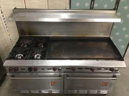 2 Wolf Ovens with 4 Burner Stove Top and Flat Grill Top. 57 x 67 x 37 inches