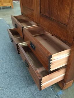 Large wooden mission style entertainment center with 4 drawers