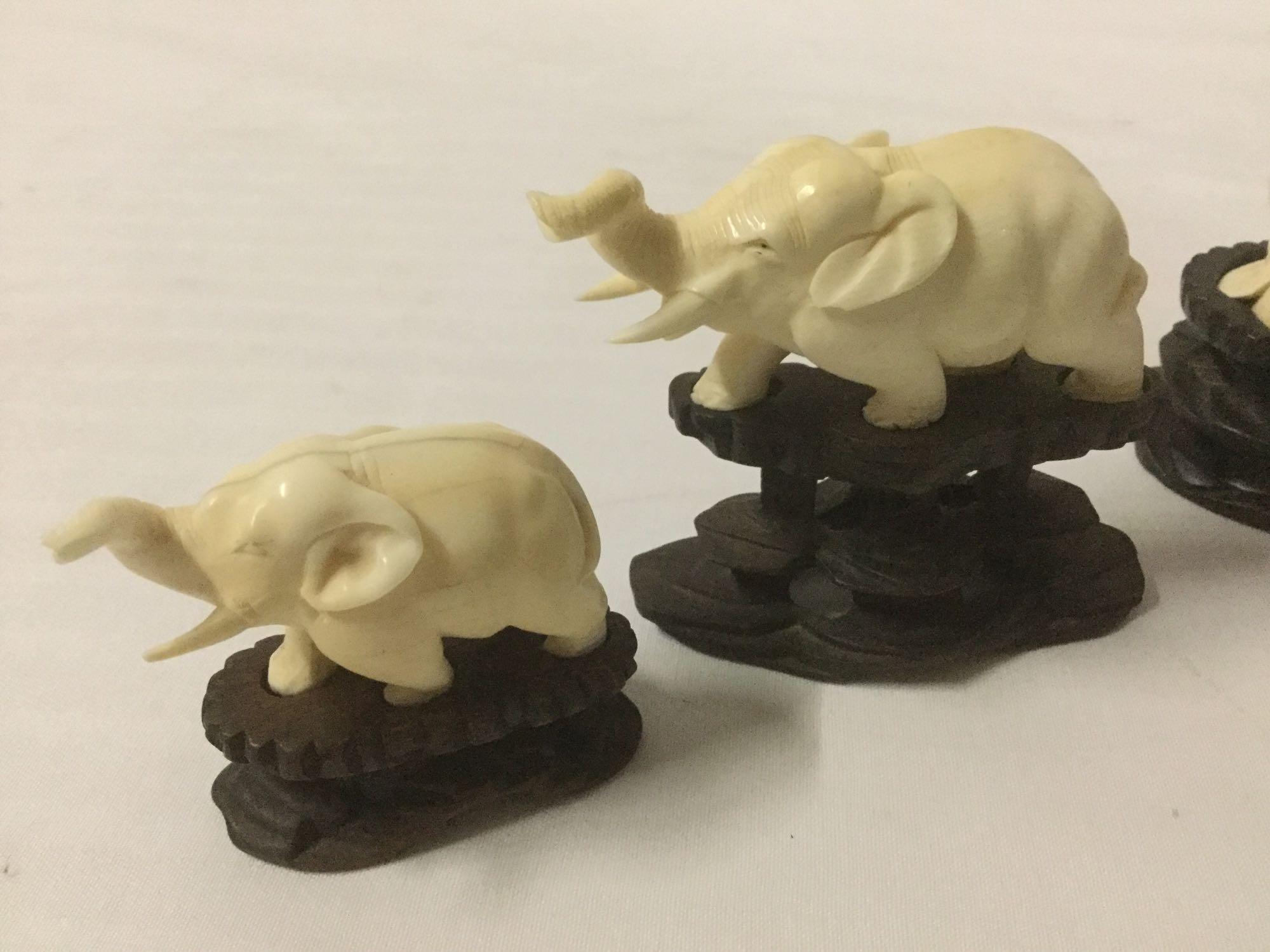 5 Asian carved bone sculpture figures with wooden bases incl. 4 elephants and Buddha