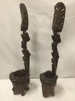 Pair of ornate Indonesian/Islander carved male/female head and totem style figures