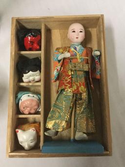 4 Vintage Asian Figures, 1 in shadowbox, x2 Ceramic Statues, and 1 porcelain doll with 4 masks and