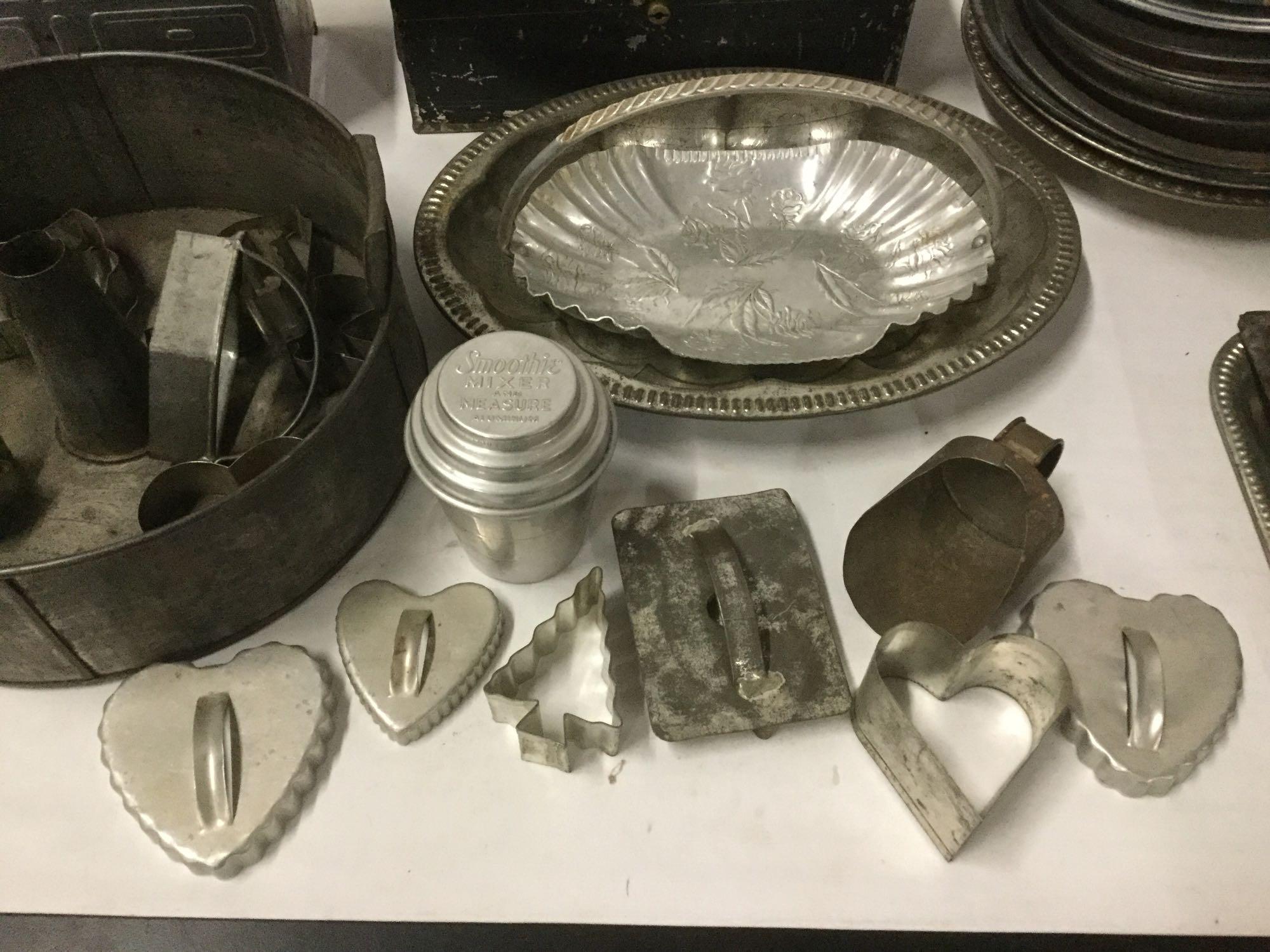 Large collection of assorted vintage Metal Kitchenware. Muffin Pans, Pie Pans, Cookie Cutters, Jars,