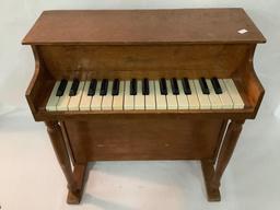 Doll size Schoenhut wooden toy piano, actually plays, approx 20x20x10 inches.