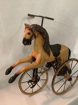 Antique composite/ metal horse tricycle sized for dolls, approximately 12 x 22 x 23 inches. Missing