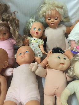 10x Vinyl baby dolls. Cabbage patch kids and more. Largest doll measures approximately 20x14x5