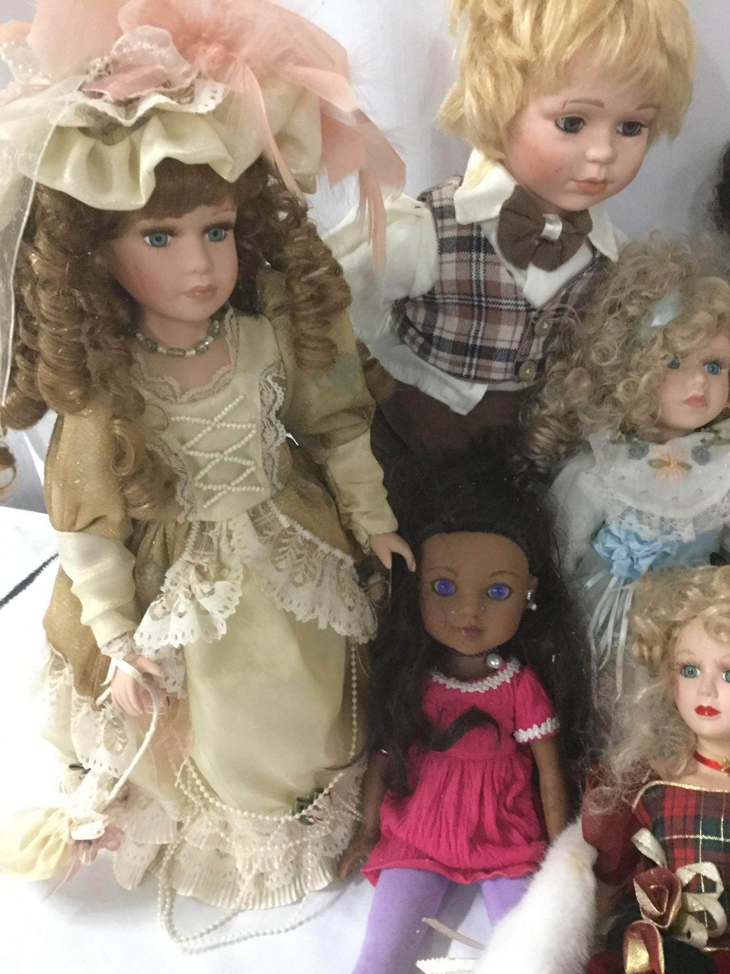 Ten porcelain and composite dolls from makers like G2G and Collectible Memories. JRL
