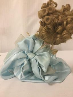 Disney porcelain doll dressed up like Cinderella. Measuring approximately 11x7x6 inches. JRL