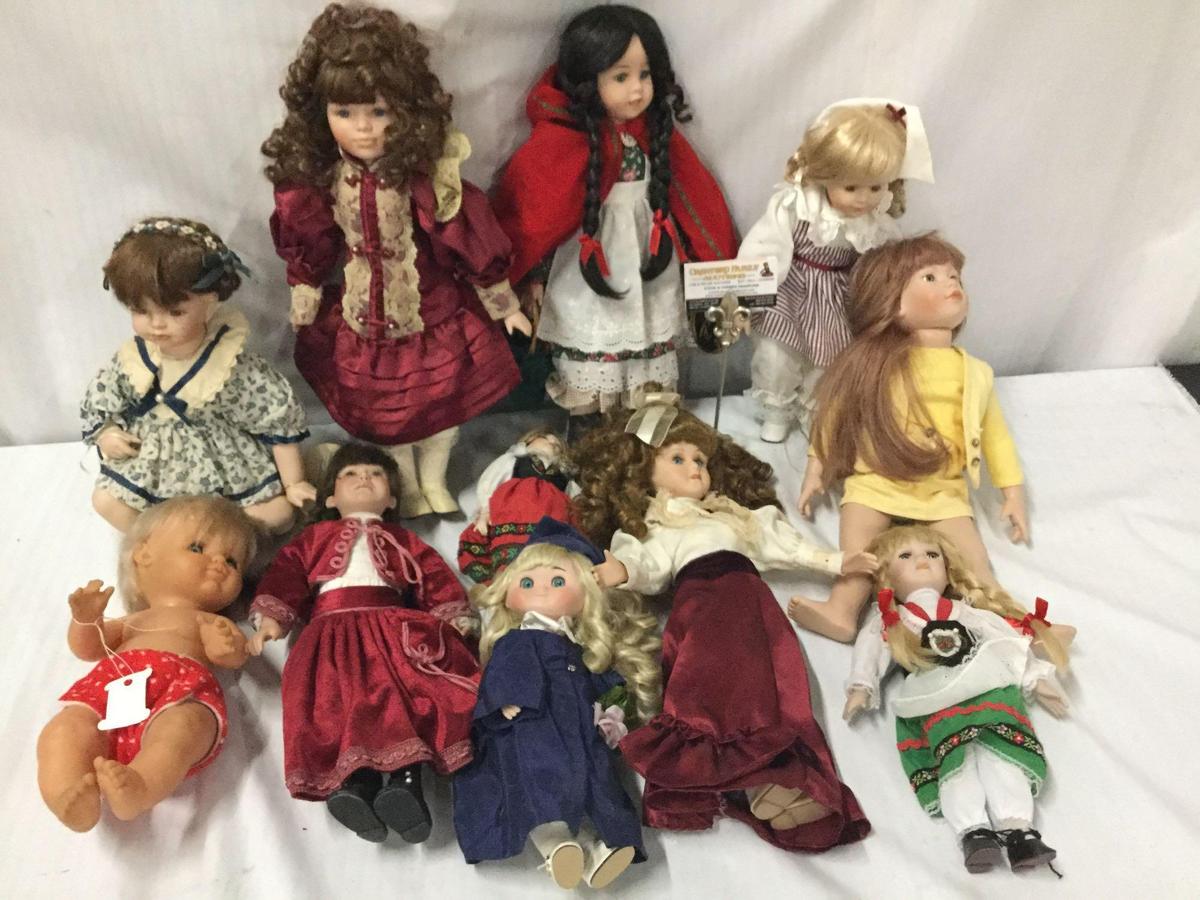 11x porcelain, composite and vinyl dolls. Famosa, Crowne and more. Largest doll measures