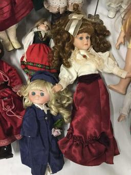 11x porcelain, composite and vinyl dolls. Famosa, Crowne and more. Largest doll measures