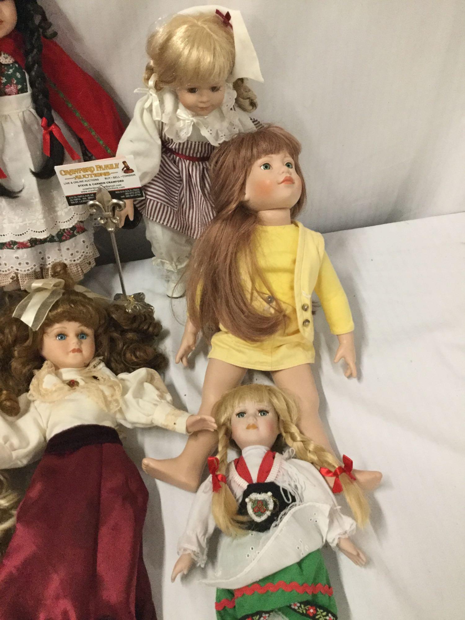 11x porcelain, composite and vinyl dolls. Famosa, Crowne and more. Largest doll measures